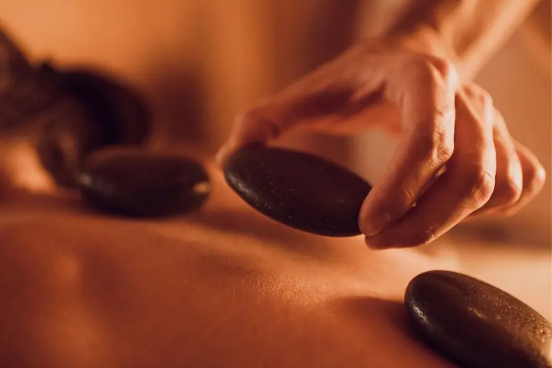 Massage with hot stones for the VIP Massage Package